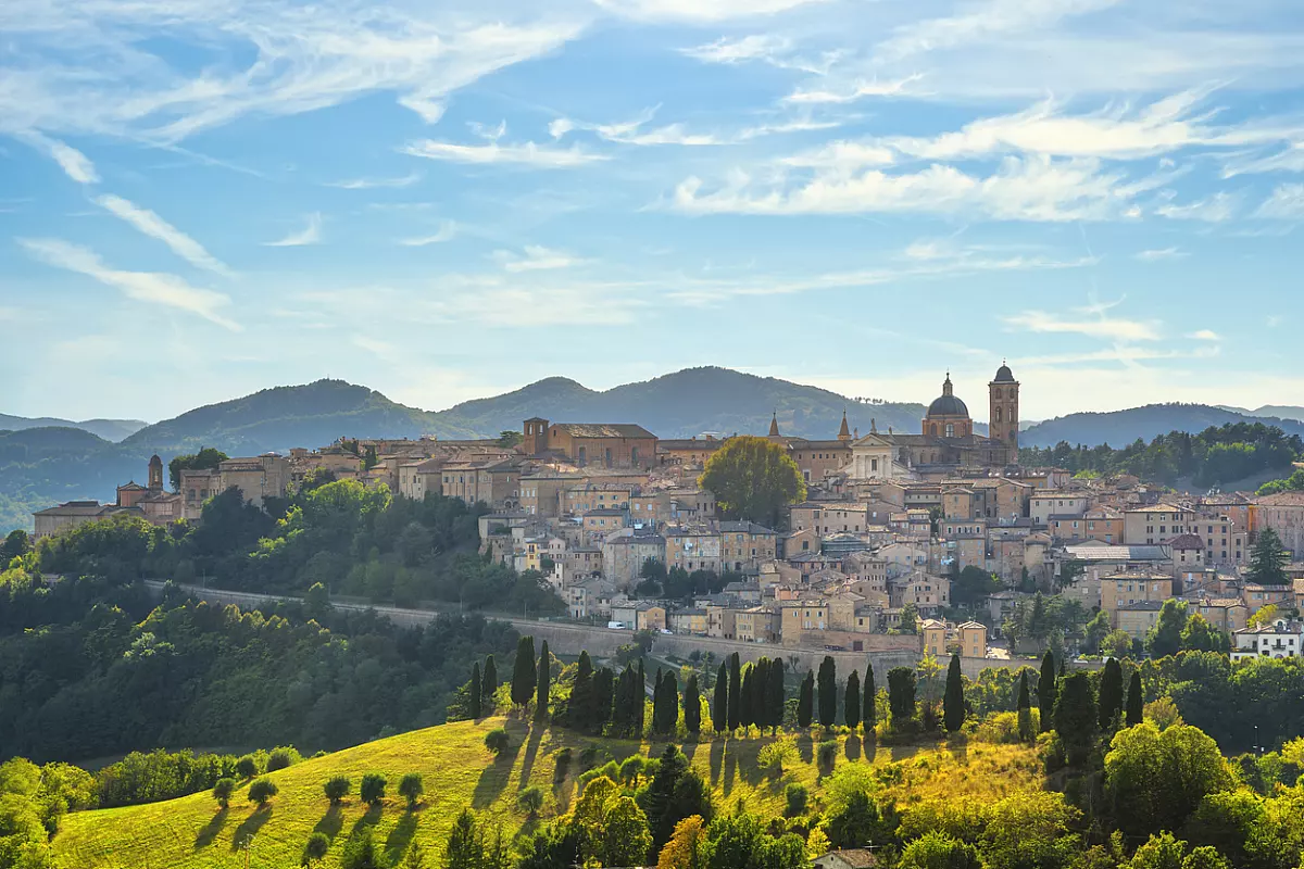 Urbino city skyline and countryside landscape. Marche region, Italy.