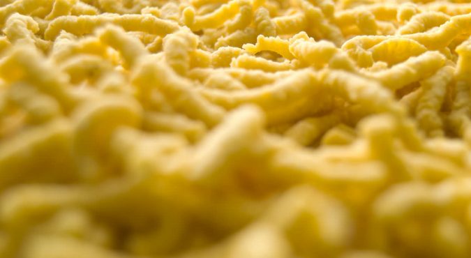 Passatelli pasta. Traditional delicious food of Modena, Emilia Romagna, Italy. Made with: eggs, bread crumbs, parmesan cheese, flour, nutmeg