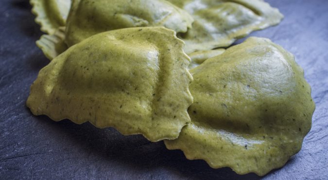 Mezzelune green fresh pasta with gorzonzola, speck and caramelised onion