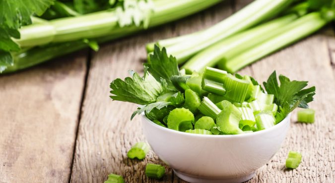 Fresh sliced celery in a white bowl
