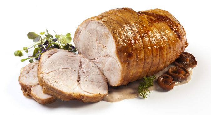 Roasted pork with sauce and garnish