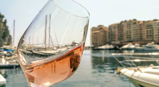 Glass of rose wine on the seacoast of the French Riviera